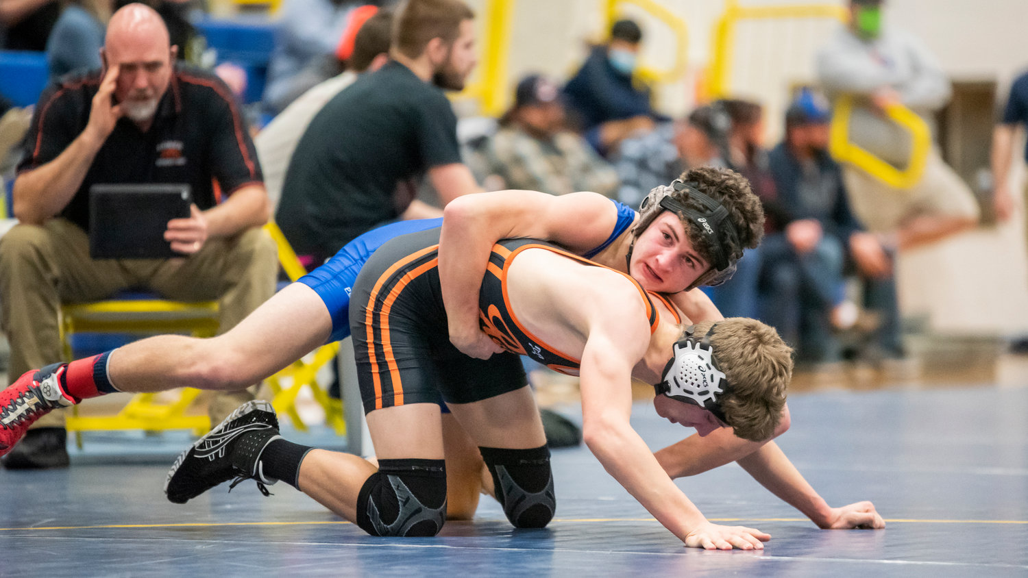 Willapa Valley’s Lucas Swogger looks to his coaches while wrestling Rainier’s Levi Swann Saturday afternoon in Adna.